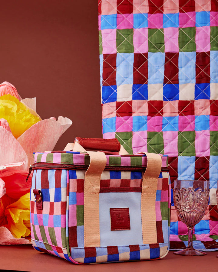 Colorful checkered bag with a quilted multicolored fabric background