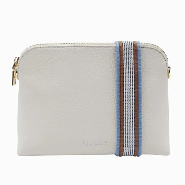 Our Hudson Cross Body Bag combines style and function with two removable straps: a classic PU strap with gold chain and a playful striped webbing strap. Available from www.thecollectivenz.com