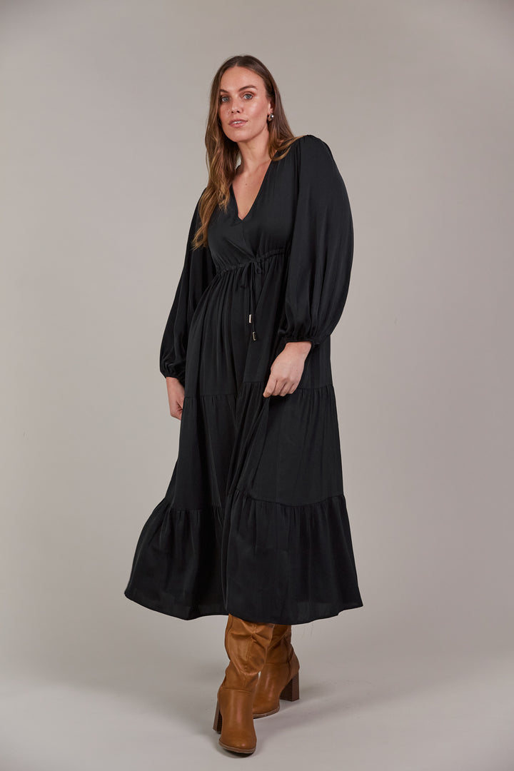 The Elsie Maxi Dress is the ultimate expression of effortless sophistication. Its flattering V-neck flows seamlessly down to an adjustable drawstring, designed to enhance and define your figure. Available from www.thecollectivenz.com
