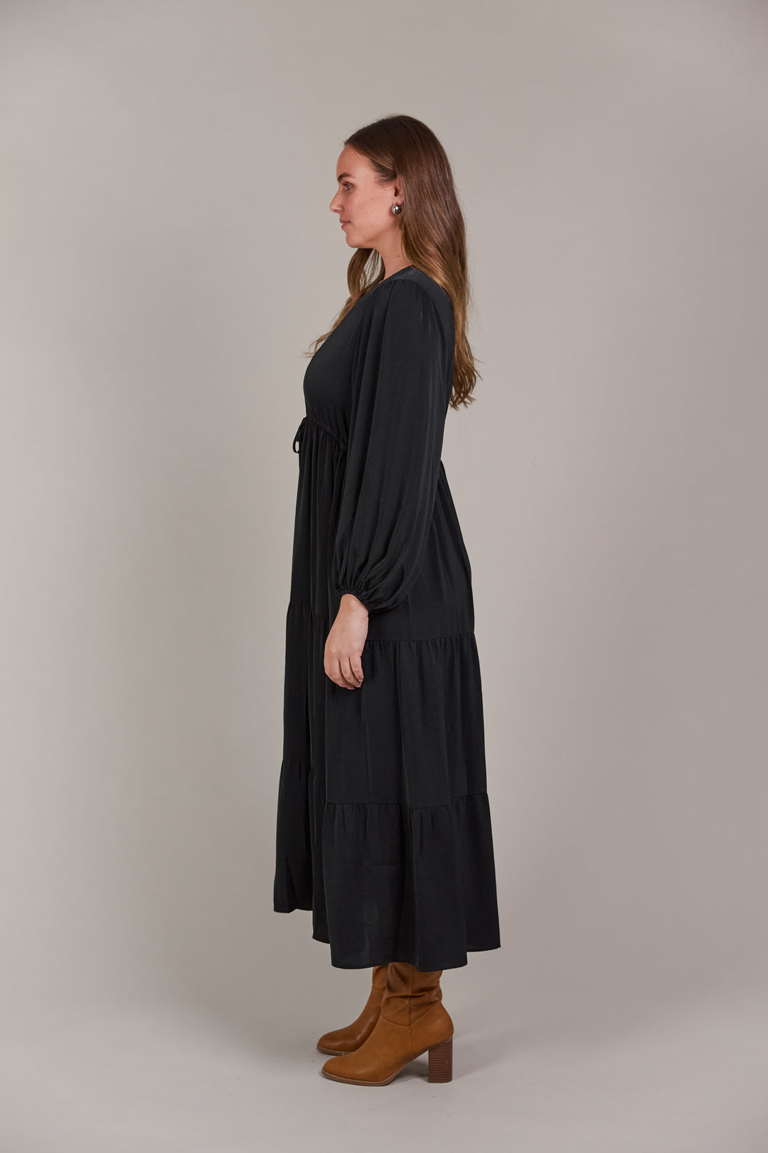 The Elsie Maxi Dress is the ultimate expression of effortless sophistication. Its flattering V-neck flows seamlessly down to an adjustable drawstring, designed to enhance and define your figure. Available from www.thecollectivenz.com