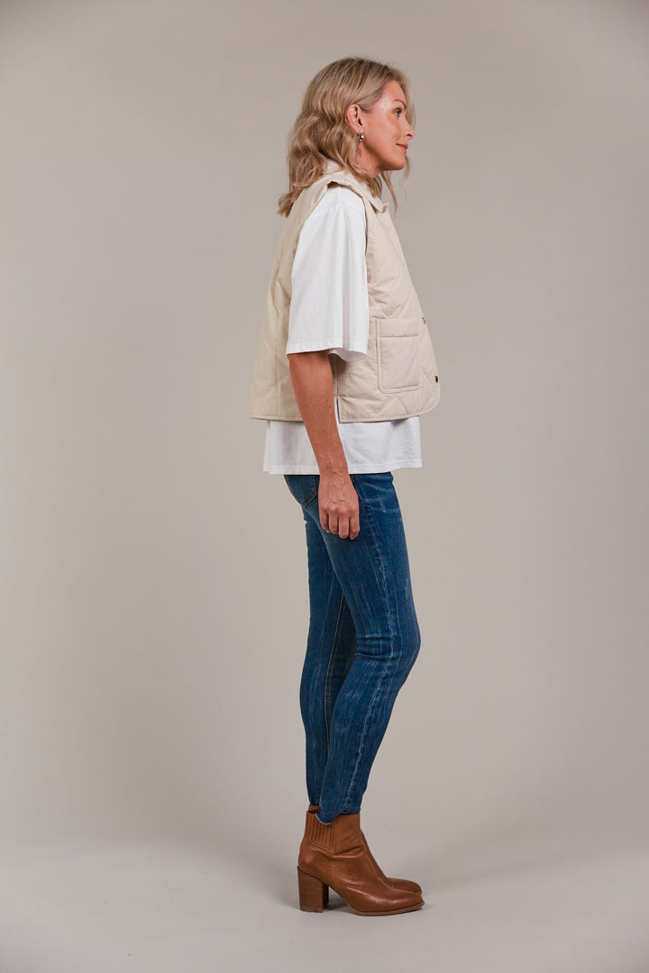 Designed with purpose, the Pepi Vest is crafted from 100% cotton and features a practical zip and press stud closure, convenient patch pockets, and an adjustable drawstring for the perfect fit. Available from www.thecollectivenz.com