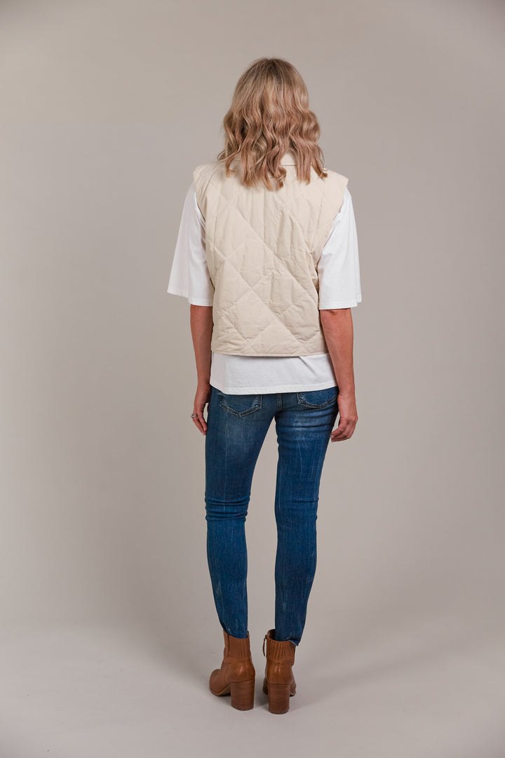 Designed with purpose, the Pepi Vest is crafted from 100% cotton and features a practical zip and press stud closure, convenient patch pockets, and an adjustable drawstring for the perfect fit. Available from www.thecollectivenz.com