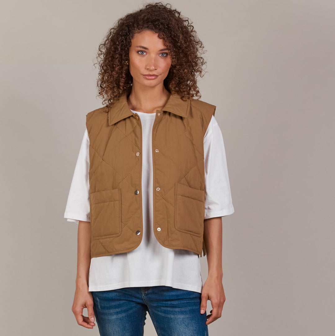 Designed with purpose, the Pepi Vest is crafted from 100% cotton and features a practical zip and press stud closure, convenient patch pockets, and an adjustable drawstring for the perfect fit. Available from www.thecollectivenz.com