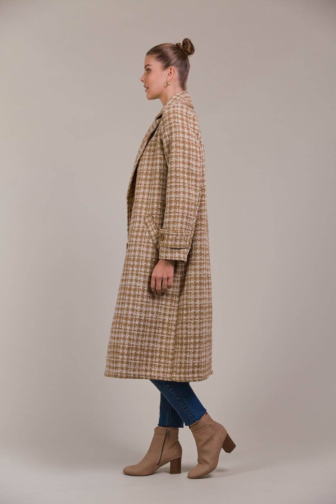 Discover refined winter styling with the Aman Coat, your ultimate companion for a polished, sophisticated look. Available from www.thecollectivenz.com