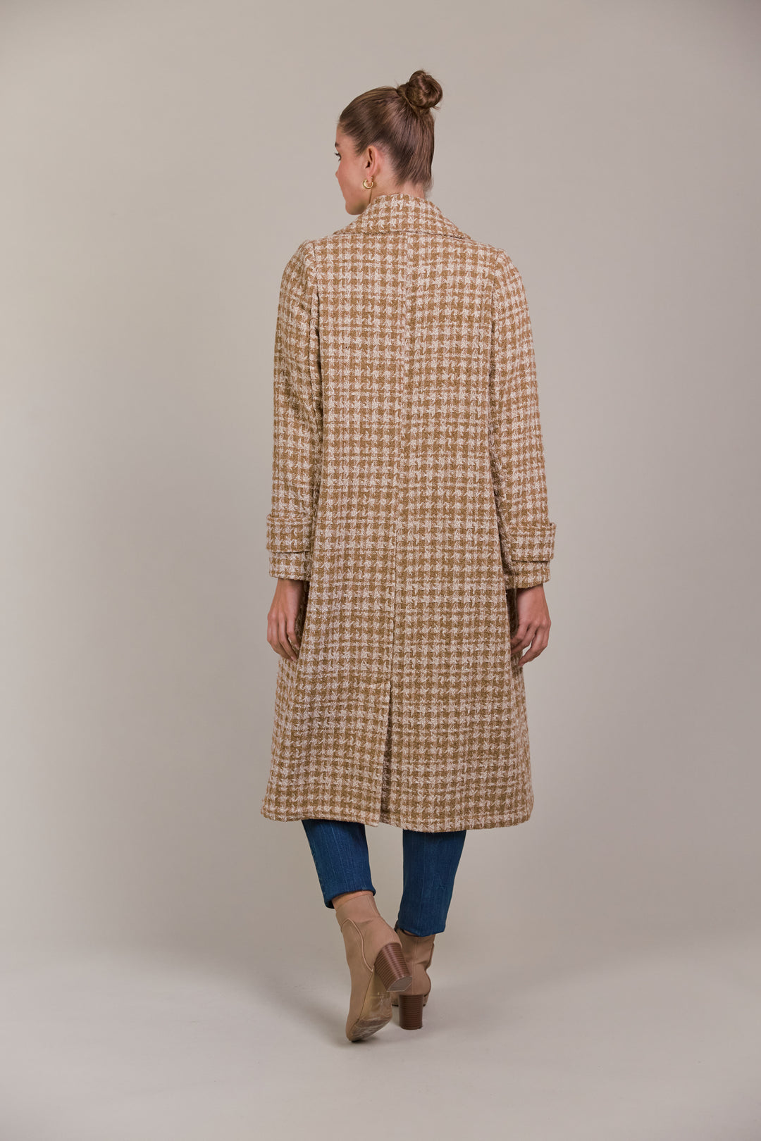 Discover refined winter styling with the Aman Coat, your ultimate companion for a polished, sophisticated look. Available from www.thecollectivenz.com