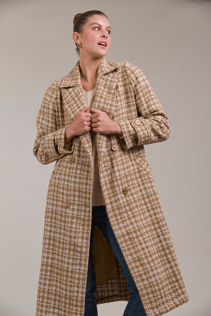 Discover refined winter styling with the Aman Coat, your ultimate companion for a polished, sophisticated look. Available from www.thecollectivenz.com