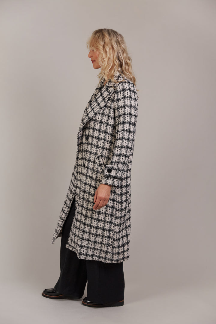 Discover refined winter styling with the Aman Coat, your ultimate companion for a polished, sophisticated look. Available from www.thecollectivenz.com