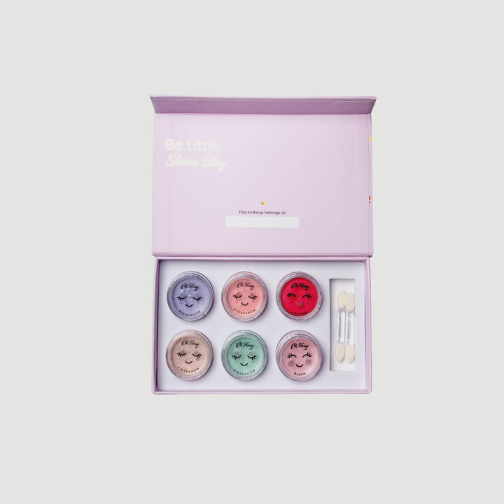 Set of facial masks in a pink box with a white background