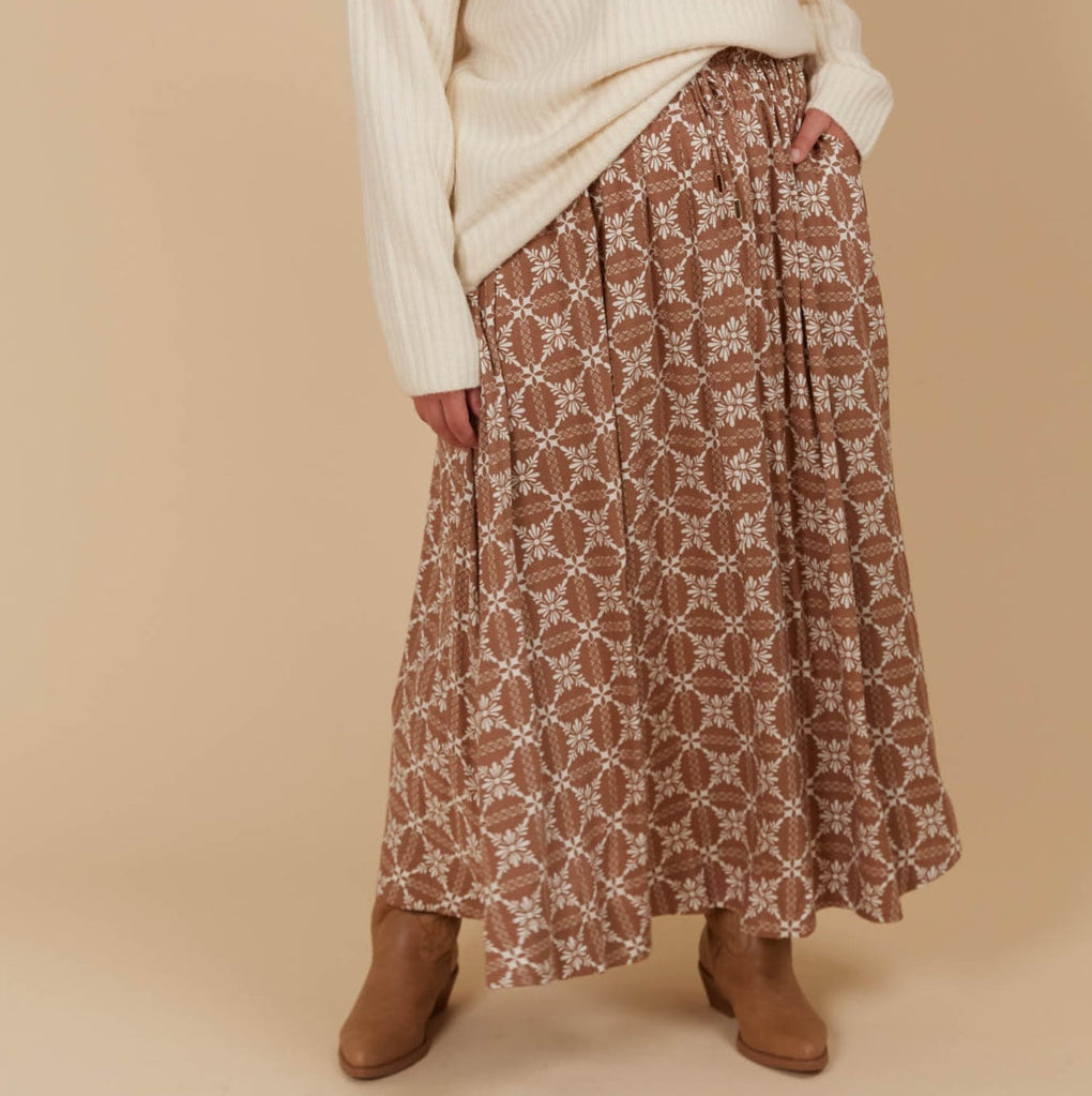 The Venus Skirt seamlessly transitions from your 9-5 to 5-9 plans. Its flowing A-line silhouette adds a soft, feminine feel, enhanced by the comfortable elastic waist and adjustable drawstring. Available from www.thecollectivenz.com