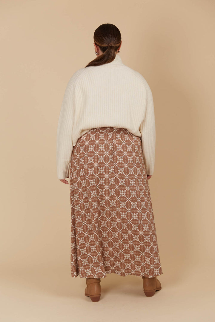 The Venus Skirt seamlessly transitions from your 9-5 to 5-9 plans. Its flowing A-line silhouette adds a soft, feminine feel, enhanced by the comfortable elastic waist and adjustable drawstring. Available from www.thecollectivenz.com