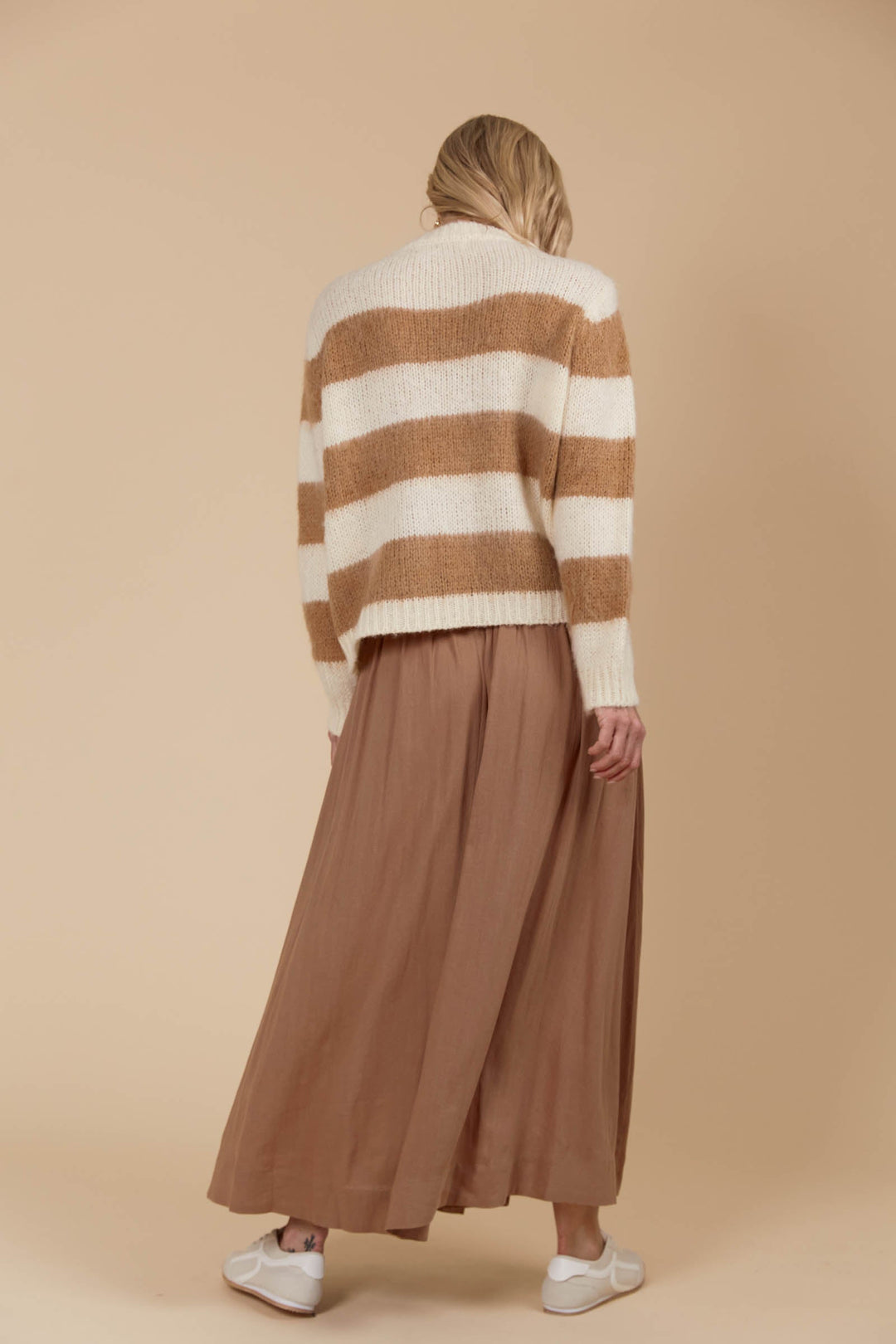 Say hello to your ultimate cosy winter staple! The Pallas Stripe Jumper wraps you in the warmth of an ultra-soft knit, making it the perfect addition to your seasonal wardrobe. Available from www.thecollectivenz.com