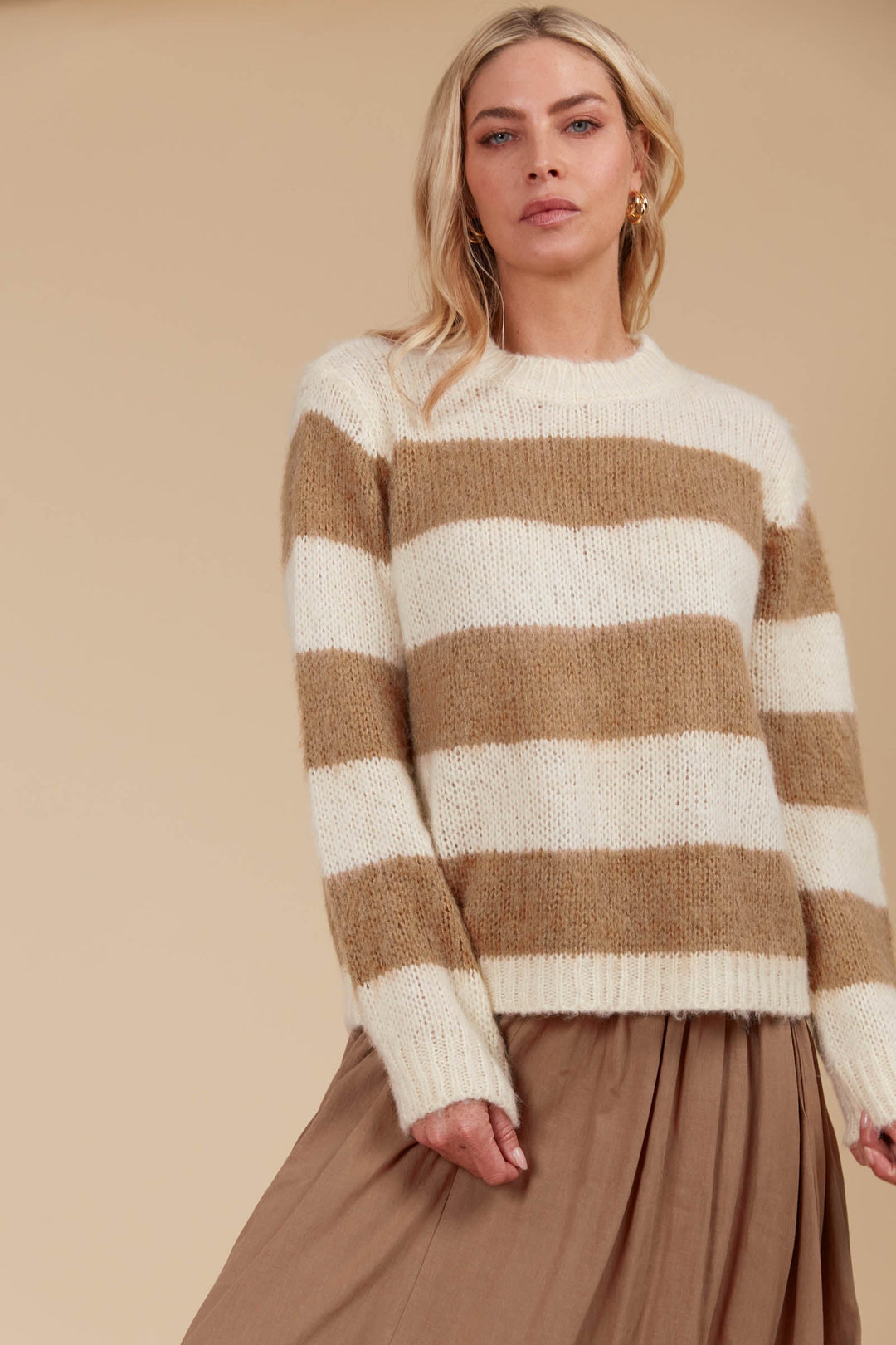 Say hello to your ultimate cosy winter staple! The Pallas Stripe Jumper wraps you in the warmth of an ultra-soft knit, making it the perfect addition to your seasonal wardrobe. Available from www.thecollectivenz.com