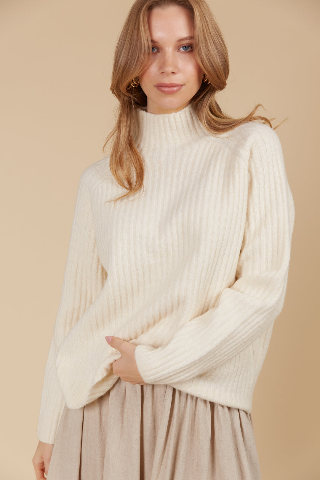 The Miru Jumper embodies cosy sophistication with its effortless silhouette and luxurious wool-recycled blend. Available from www.thecollectivenz.com