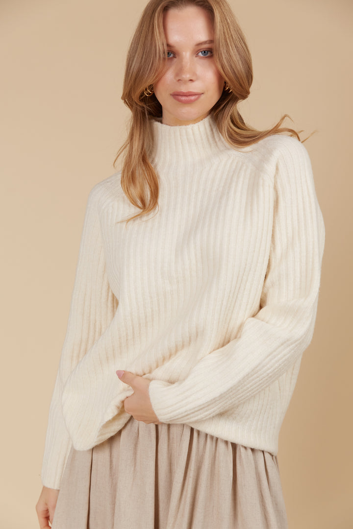 The Miru Jumper embodies cosy sophistication with its effortless silhouette and luxurious wool-recycled blend. Available from www.thecollectivenz.com