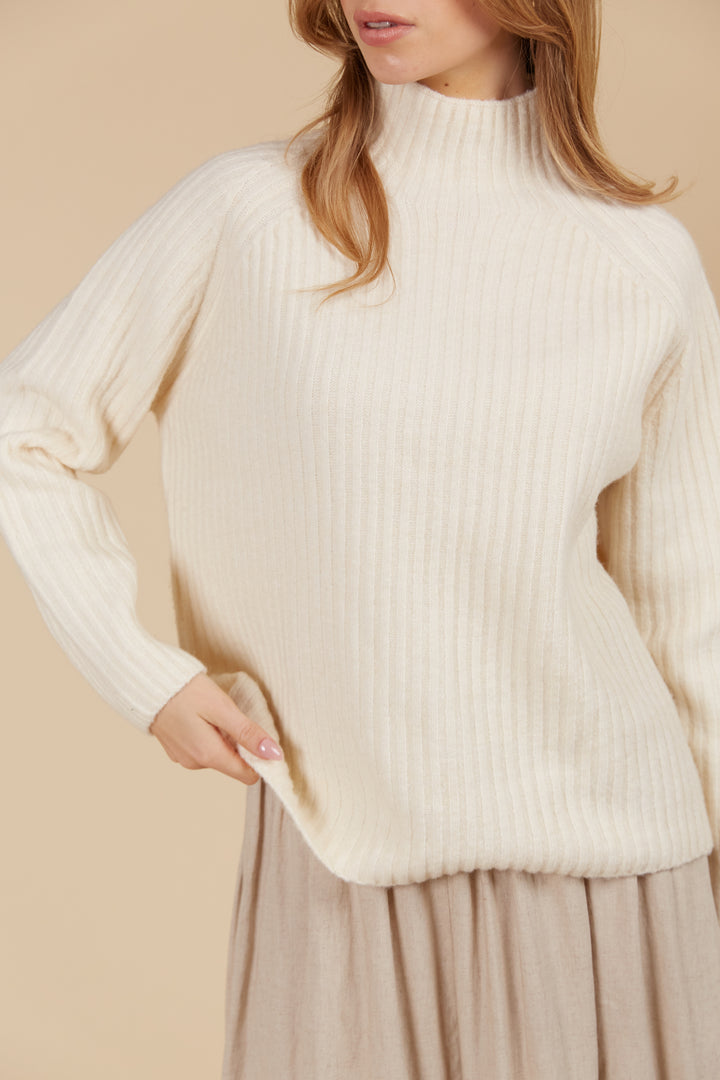 The Miru Jumper embodies cosy sophistication with its effortless silhouette and luxurious wool-recycled blend. Available from www.thecollectivenz.com