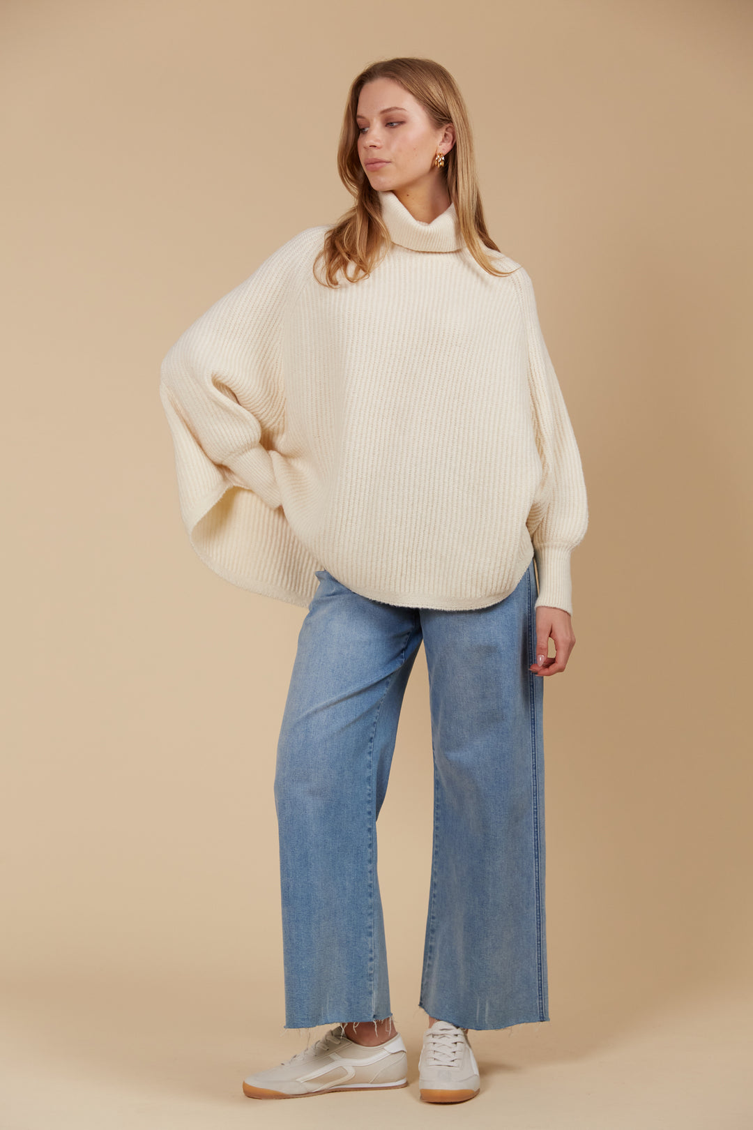 Made from a luxurious wool and recycled polyester blend, the Miru Poncho features a longer length and a rolled turtleneck, making it ideal for cooler weather. Available from www.thecollectivenz.com