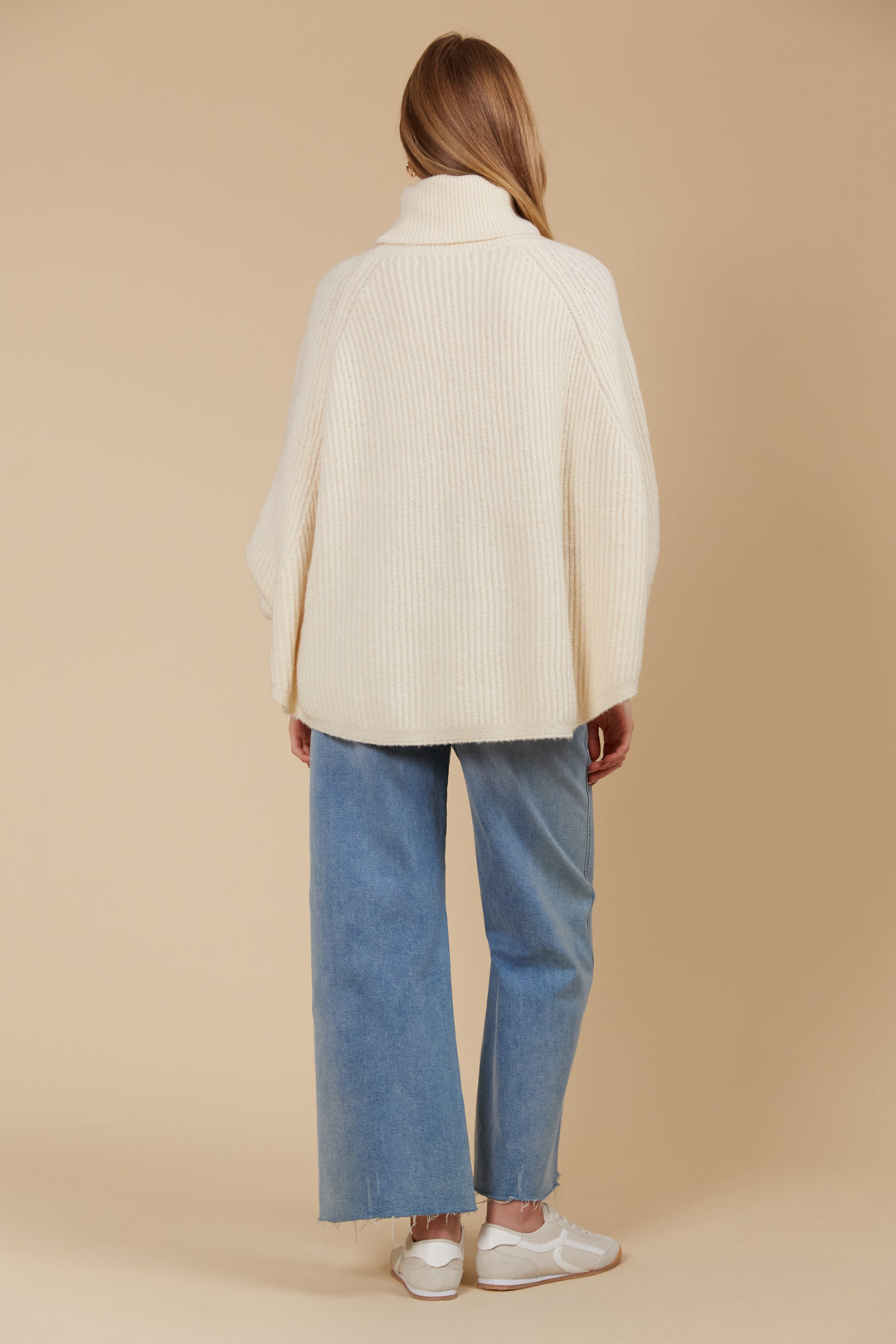 Made from a luxurious wool and recycled polyester blend, the Miru Poncho features a longer length and a rolled turtleneck, making it ideal for cooler weather. Available from www.thecollectivenz.com