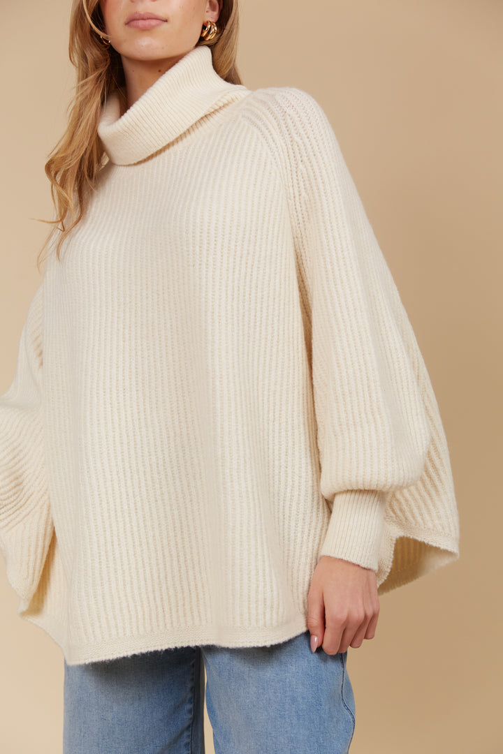 Made from a luxurious wool and recycled polyester blend, the Miru Poncho features a longer length and a rolled turtleneck, making it ideal for cooler weather. Available from www.thecollectivenz.com