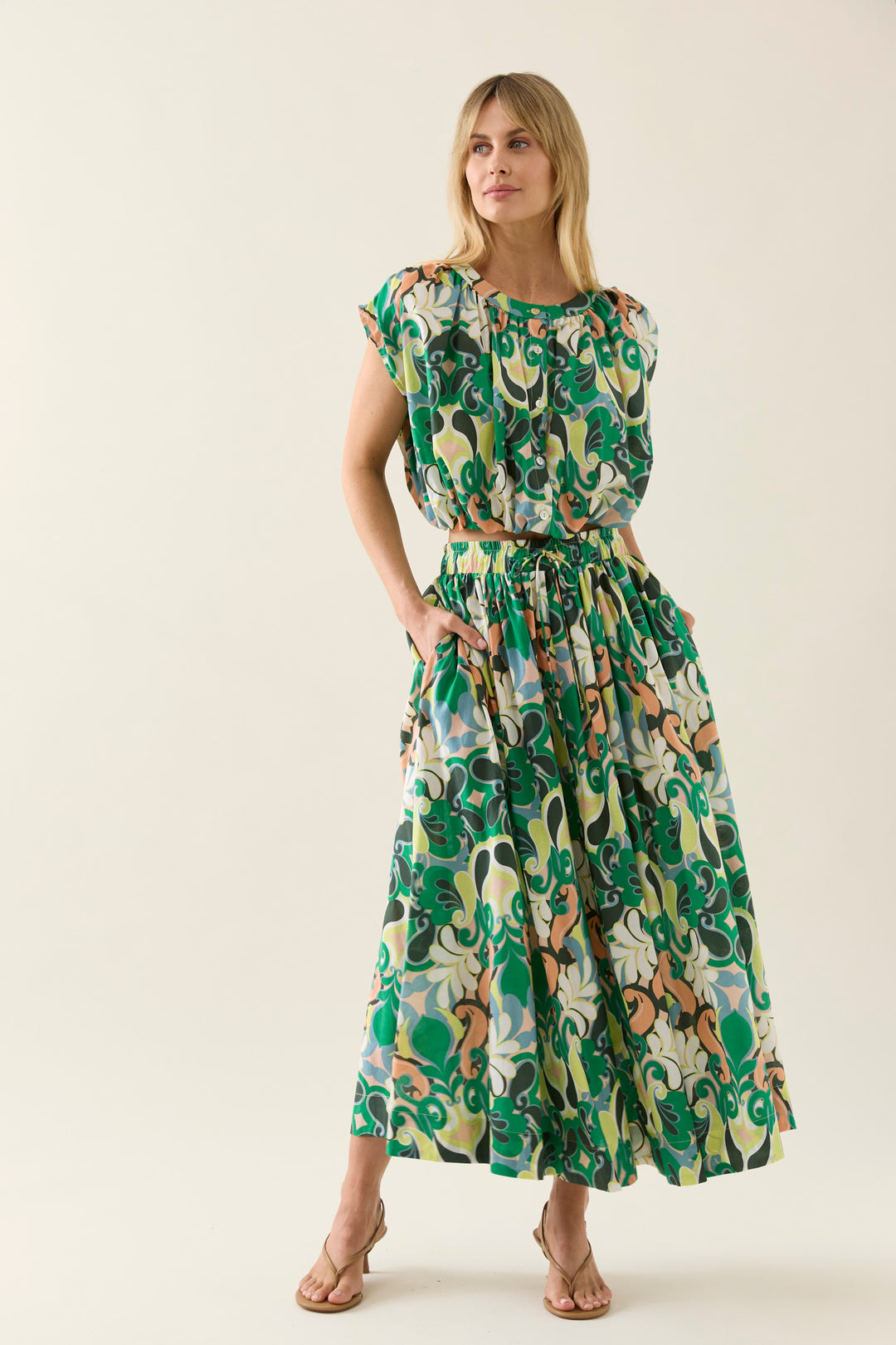 Woman wearing a floral isle of mine outfit on a white background