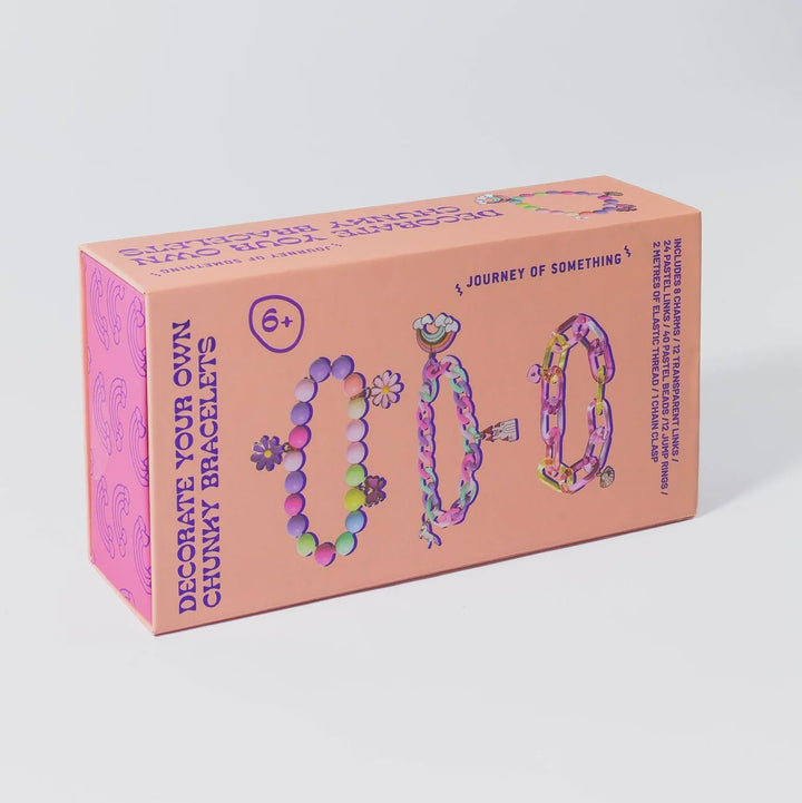 Box of chompy bracelets with colorful designs on a white background