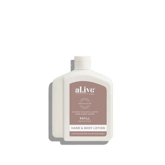 White bottle of al.ive hand and body lotion on a white background