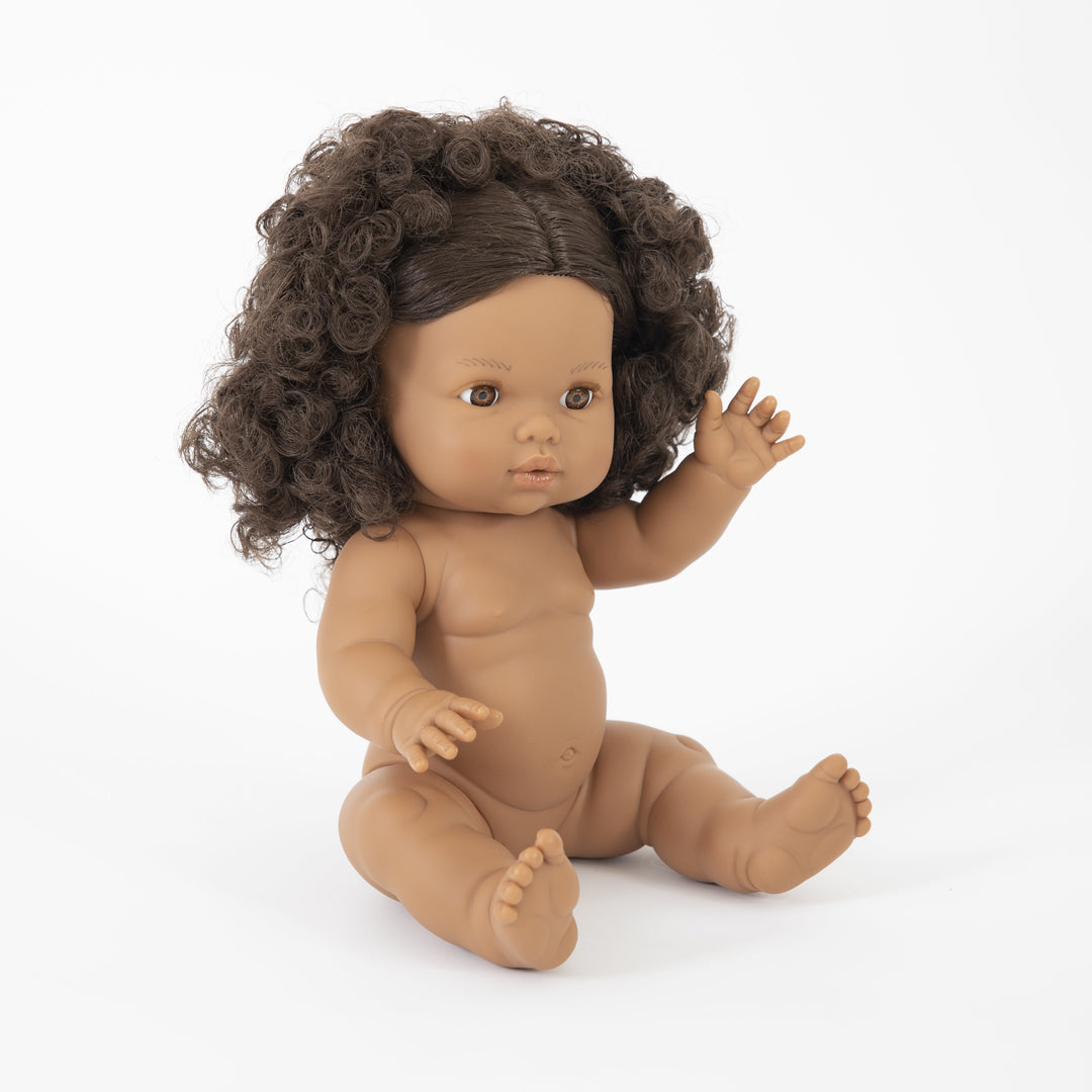 Baby doll with curly hair on a white background