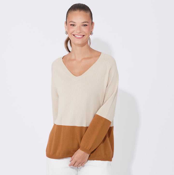 The Casablanca Block Knit combines simplicity with a touch of modern flair. This easygoing boxy sweater is designed with raglan sleeves and a V-neck for a relaxed fit. Available from www.thecollectivenz.com