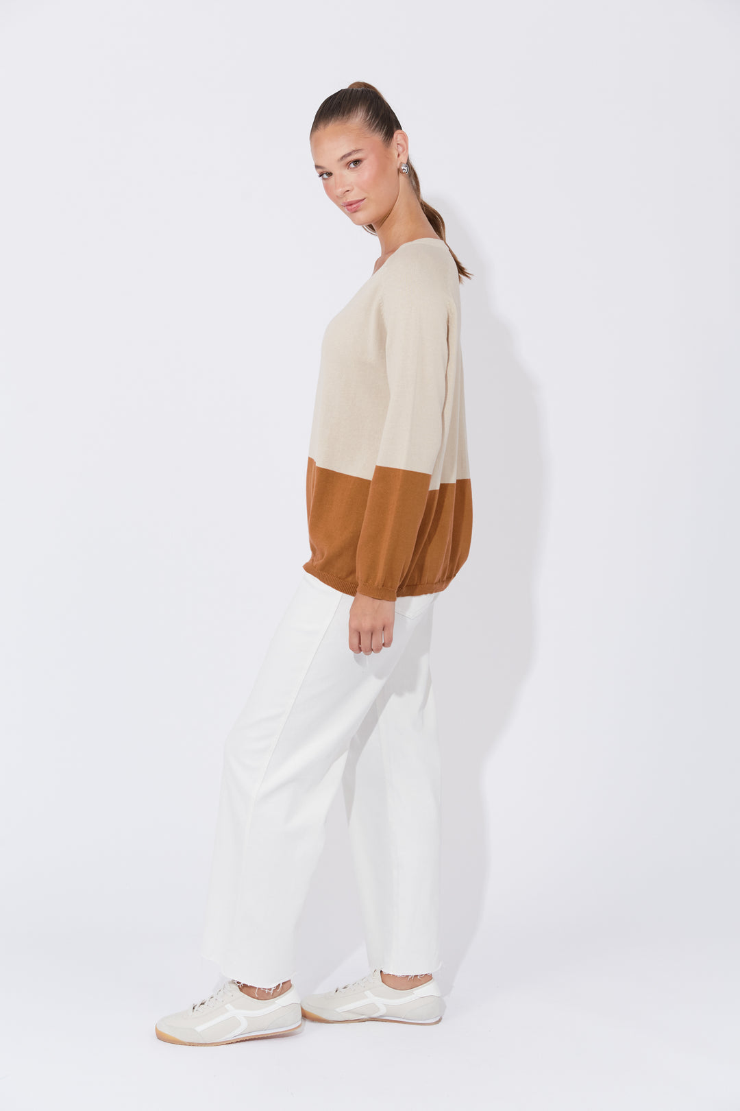 The Casablanca Block Knit combines simplicity with a touch of modern flair. This easygoing boxy sweater is designed with raglan sleeves and a V-neck for a relaxed fit. Available from www.thecollectivenz.com
