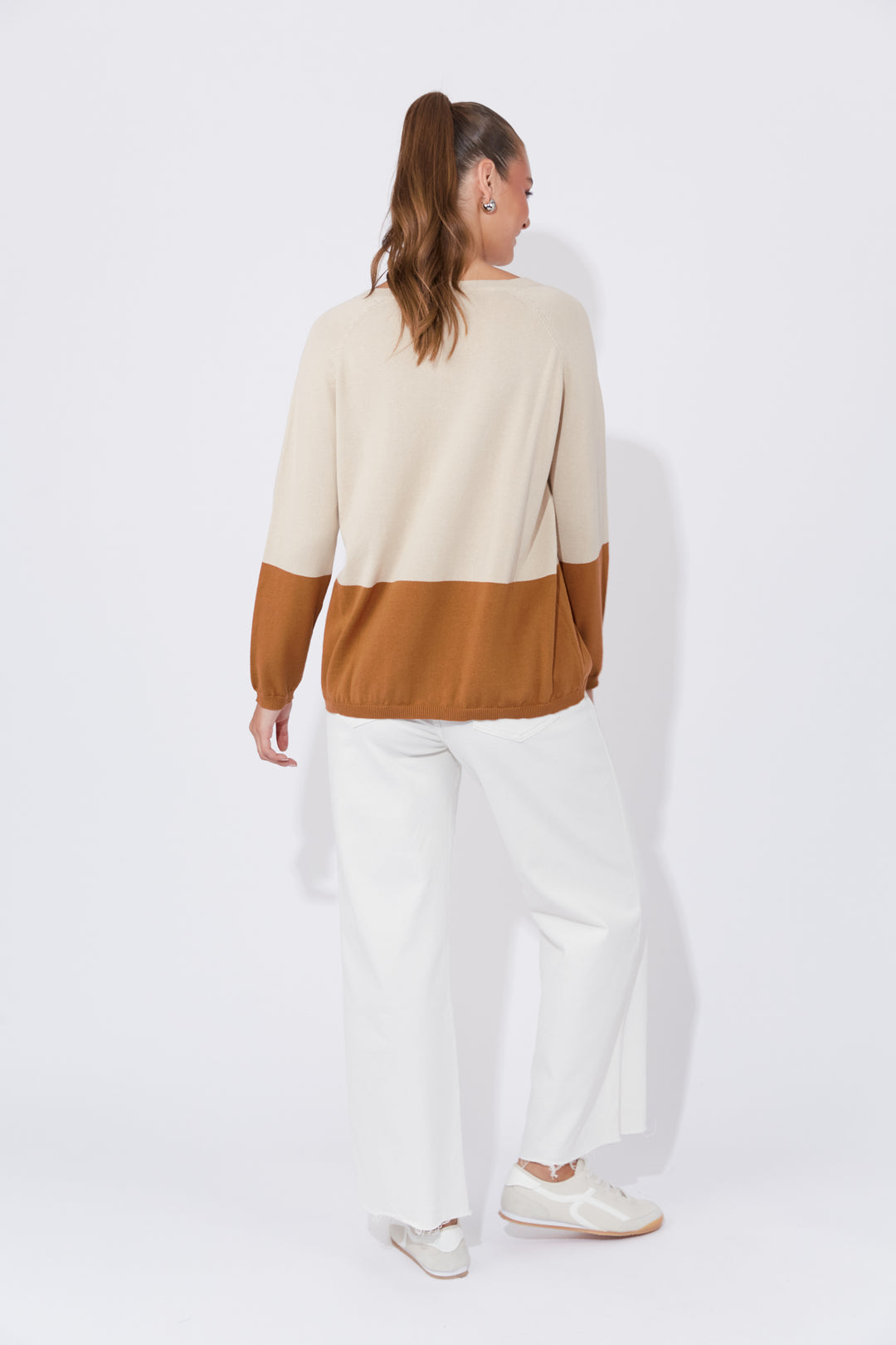 The Casablanca Block Knit combines simplicity with a touch of modern flair. This easygoing boxy sweater is designed with raglan sleeves and a V-neck for a relaxed fit. Available from www.thecollectivenz.com