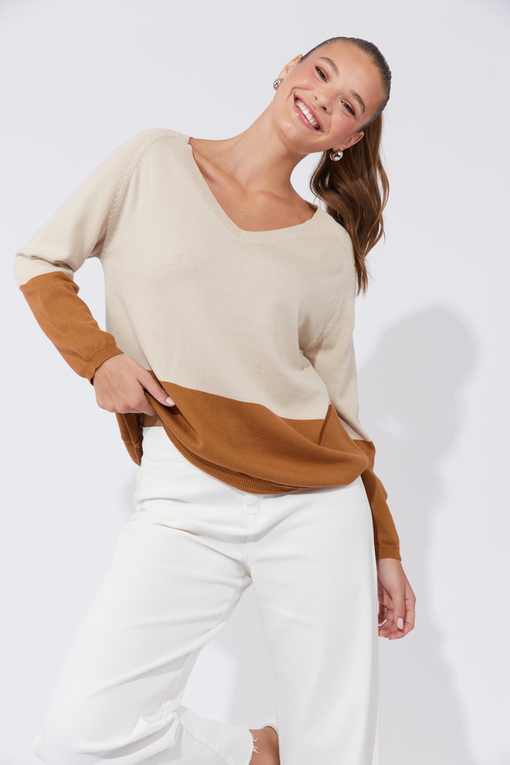 The Casablanca Block Knit combines simplicity with a touch of modern flair. This easygoing boxy sweater is designed with raglan sleeves and a V-neck for a relaxed fit. Available from www.thecollectivenz.com