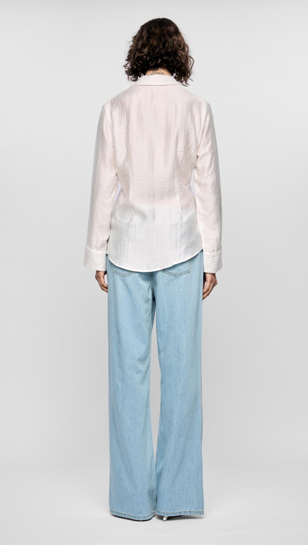 Staple the label Amara Pintuck Shirt is crafted from a lightweight fabric with a soft crinkle texture, making it perfect for everyday wear. Available from www.thecollectivenz.com