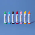 Set of colorful Honeysticks bath crayons on a blue background