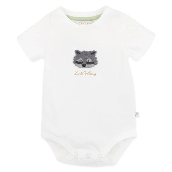 Bebe White baby bodysuit with a raccoon design and 'Little Wildling' text on a white background