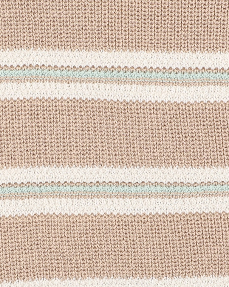 Close-up of a knitted fabric with horizontal stripes in beige, white, and light blue.