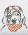 Bebe Illustration of a dog wearing goggles and a checkered bandana on a white background