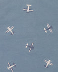 Pattern of small airplanes on a blue background