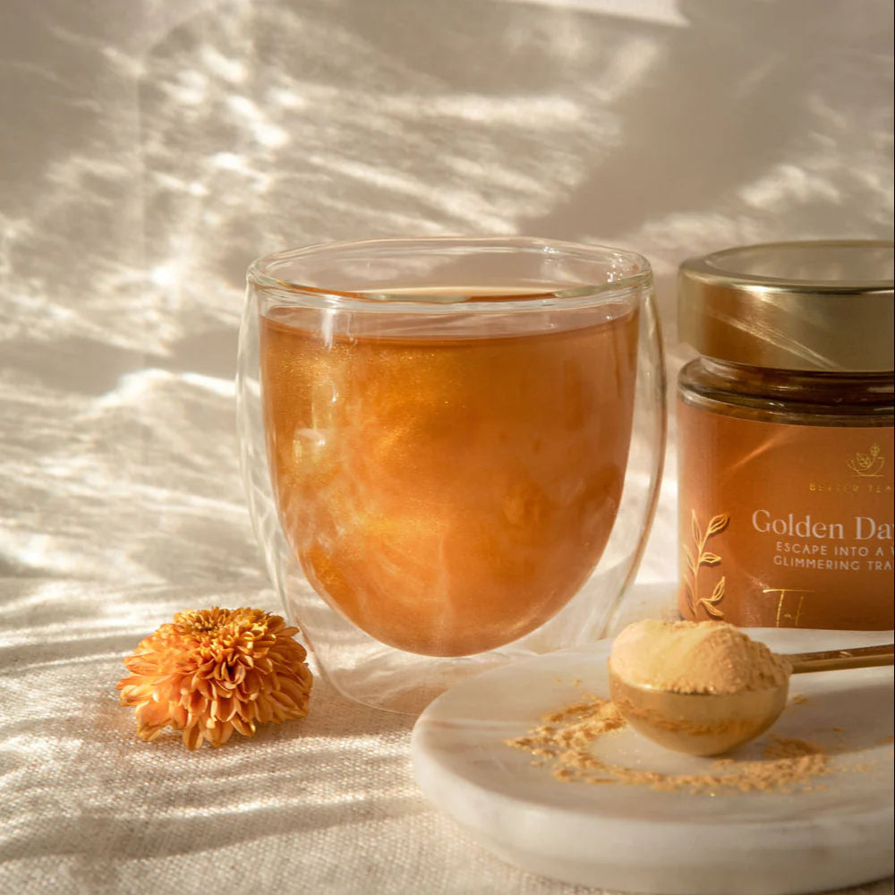 Escape the everyday with Golden Daydream, a captivating tea crafted from powdered chrysanthemum and mesmerising, 100% edible glitter dust. Available from www.thecollectivenz.com