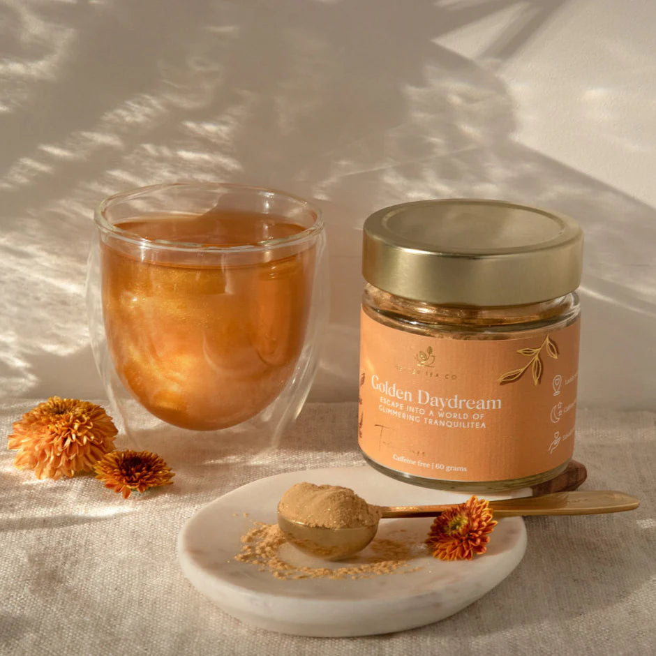 Escape the everyday with Golden Daydream, a captivating tea crafted from powdered chrysanthemum and mesmerising, 100% edible glitter dust. Available from www.thecollectivenz.com