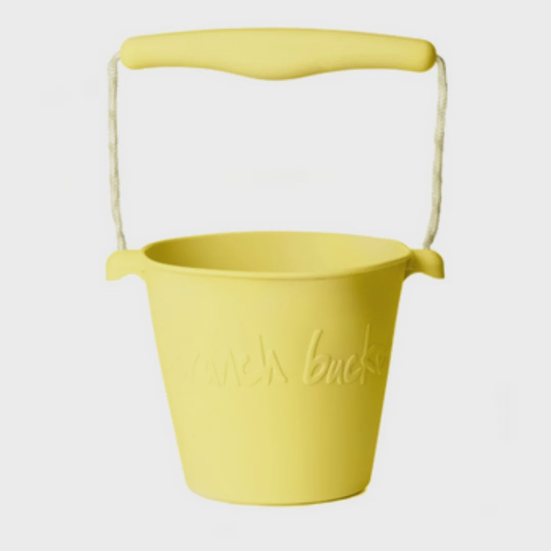 A yellow plastic bucket with a matching yellow handle and a white rope handle strap, featuring the embossed brand name 'Punch Bucks' on the front, set against a plain light gray background.