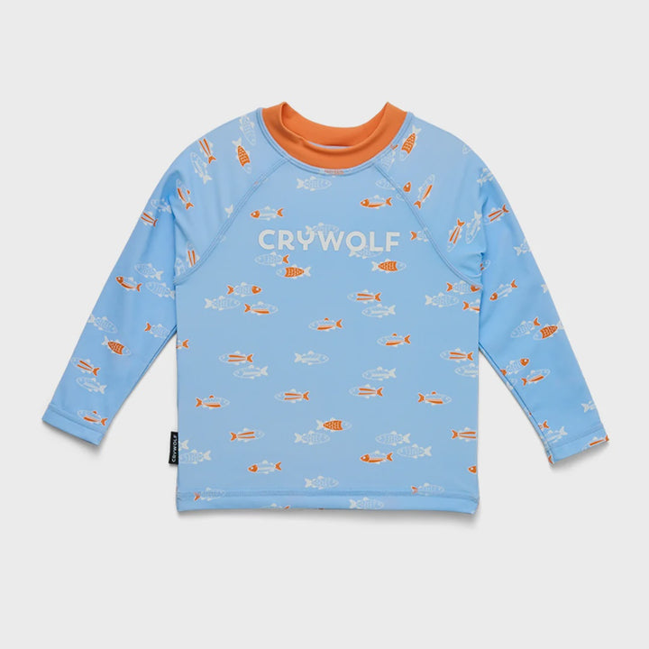A light blue long-sleeve swim shirt with an orange crew neck, featuring a repeating pattern of orange and white fish, and the brand name 'CRYWOLF' printed across the chest.
