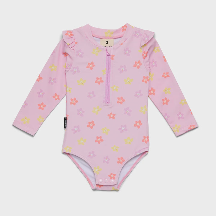 A baby long-sleeve swim bodysuit in light pink with a floral print in yellow, orange, and purple, featuring a half-zip neckline.