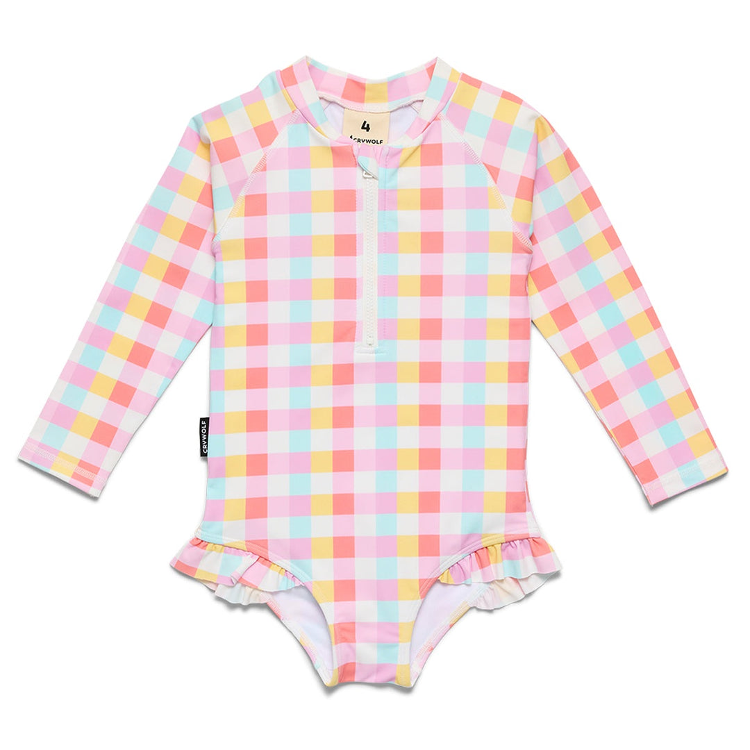 A long-sleeve baby swim shirt featuring a pastel pink, yellow, and light blue gingham check pattern with a half-zip neckline and a ruffled leg opening, shown on a plain white background.
