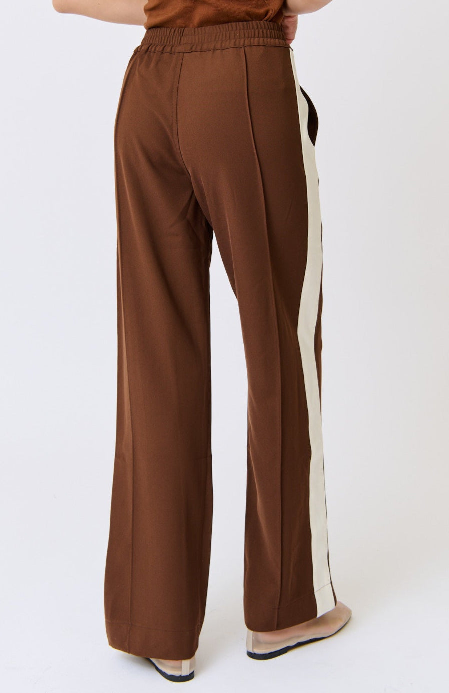 Brown pants with a white stripe on a white background