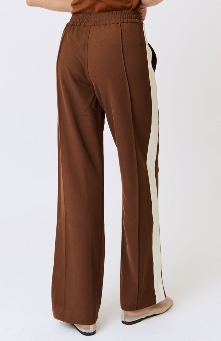 Brown pants with a white stripe on a white background