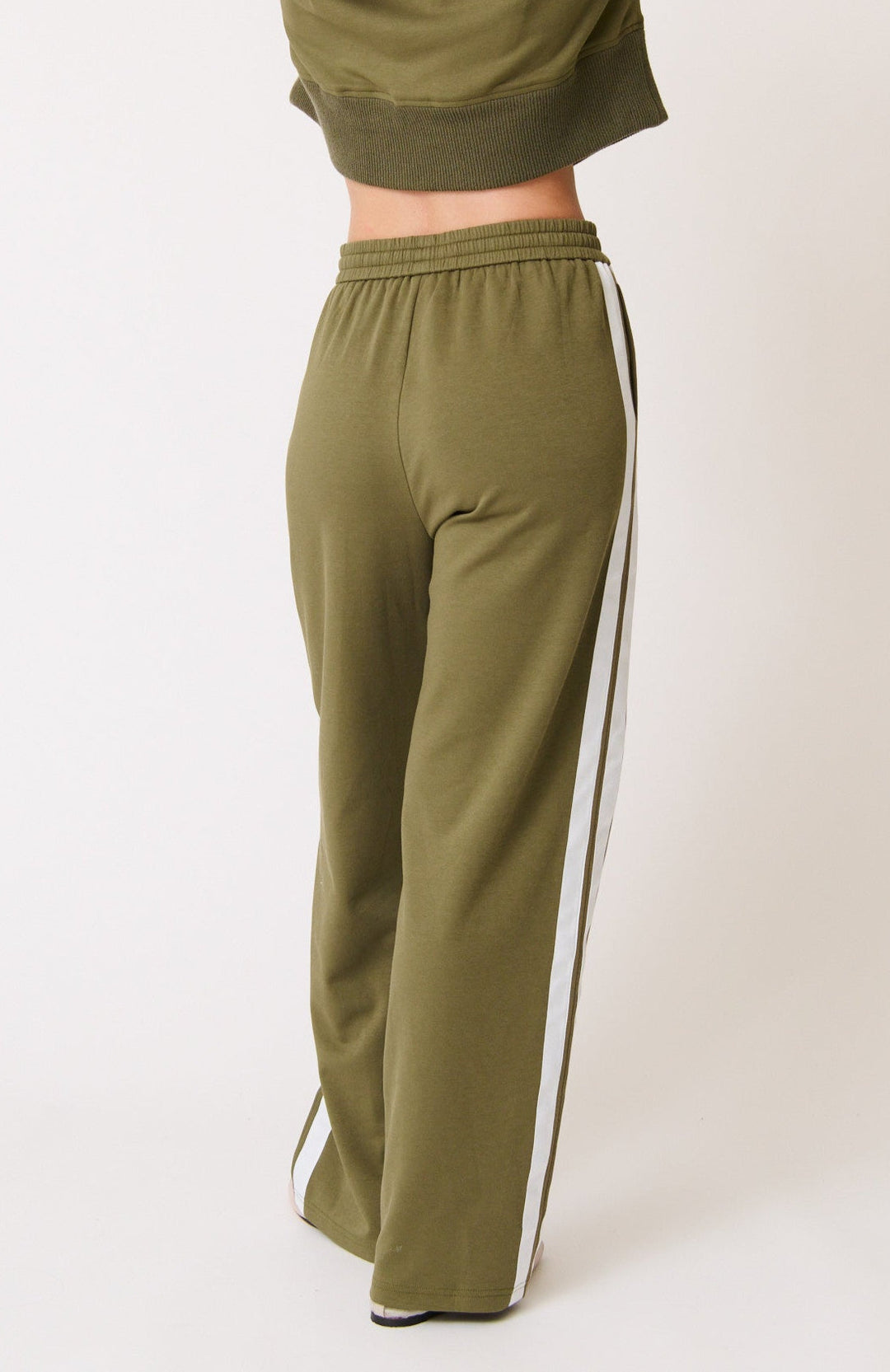 cartel & willow olive green adeline n tracksuit with white stripes on a plain background