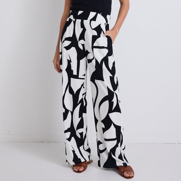 Step up your style game with our Metropolitan Black White Cutout Print Pants! Made with a soft printed linen cotton blend for easy comfort and style, available from www.thecollectivenz.com