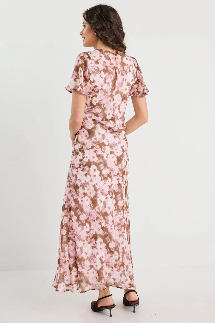 Woman wearing a floral dress on a white background