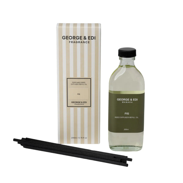 George & Edi fragrance set with bottle, packaging, and diffuser sticks on a white background
