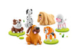 Set of colorful dog figurines on a white background