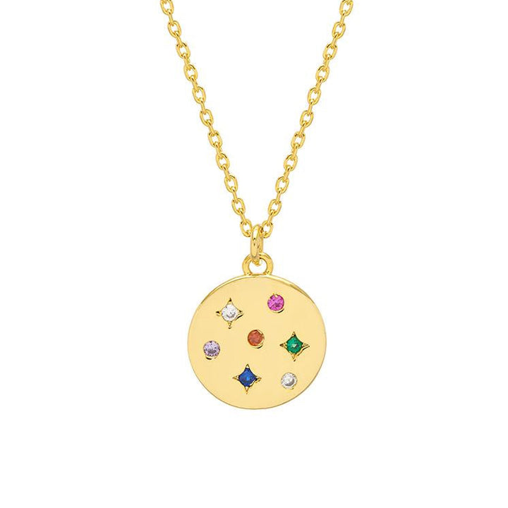 Gold necklace with a round pendant featuring colorful gemstones on a white background